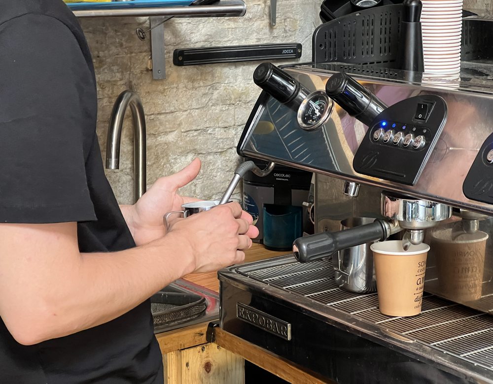 Barista preparing coffee at Coffee & Tea House, Granada