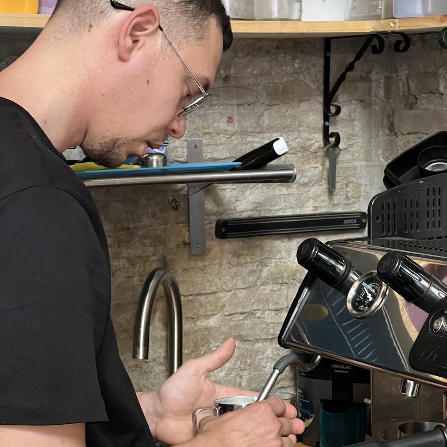 Barista pulling a shot at the espresso machine