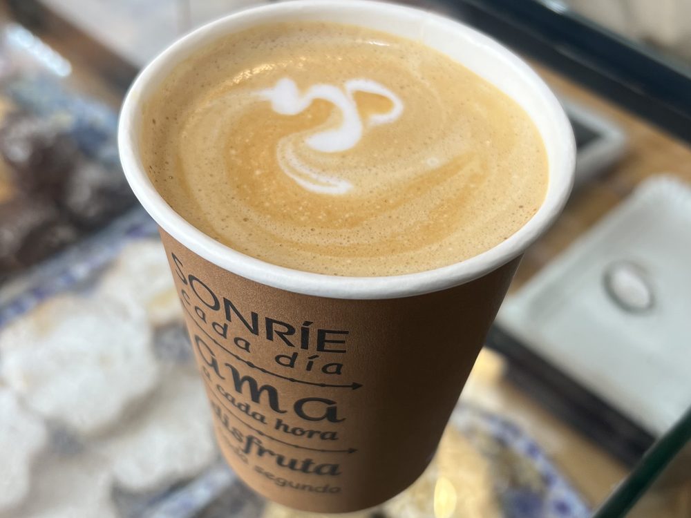 Latte and pastries seen from above
