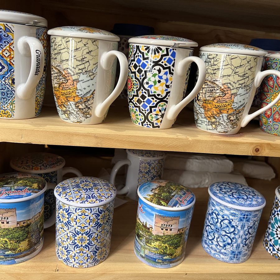 Hand-painted ceramic mugs on display