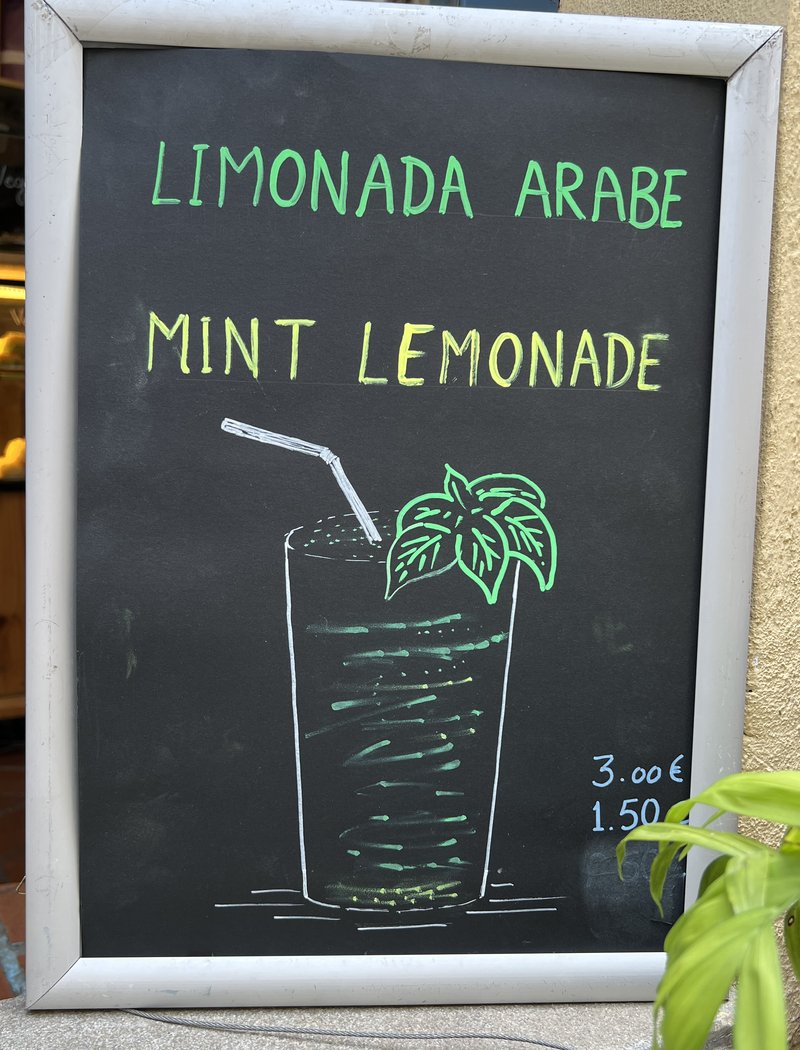 Hand-drawn Arabic mint lemonade sign outside Coffee & Tea House